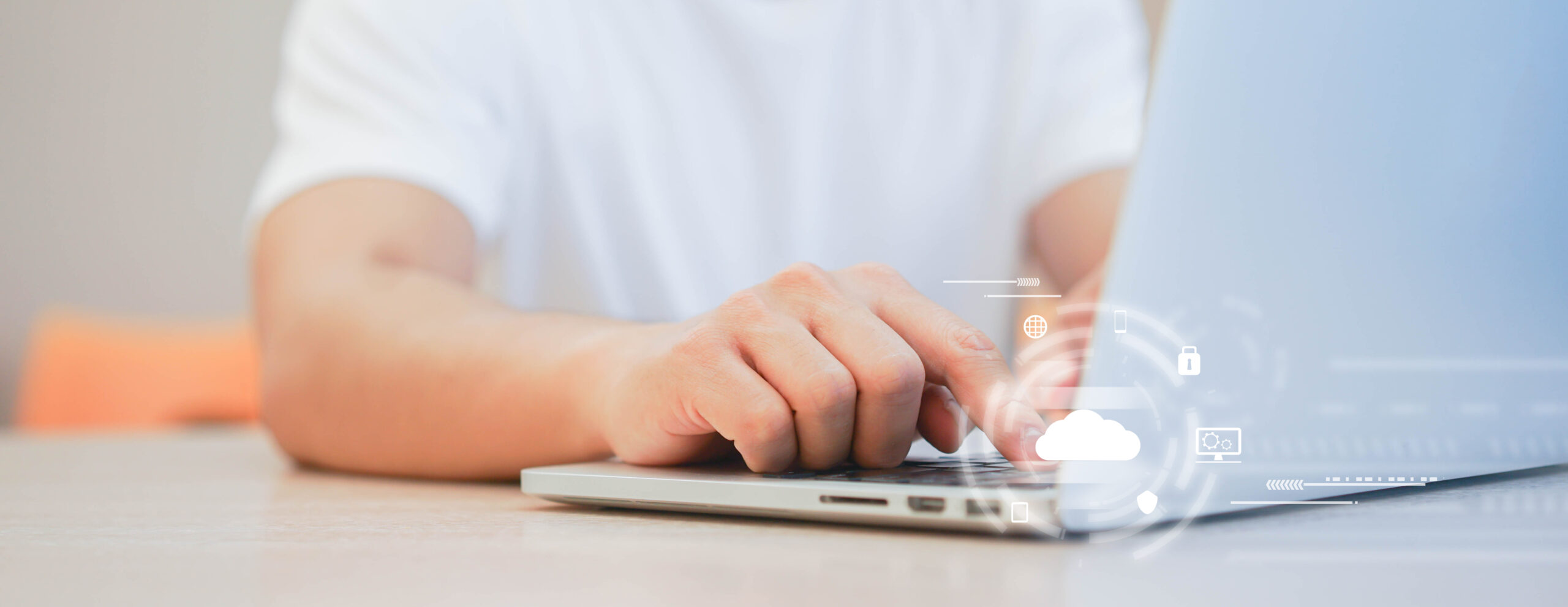 A person wearing a white shirt types on a laptop, with digital cloud and security icons overlaid in the foreground, illustrating cloud computing concepts such as online data security and the benefits of SD-WAN for secure connectivity.