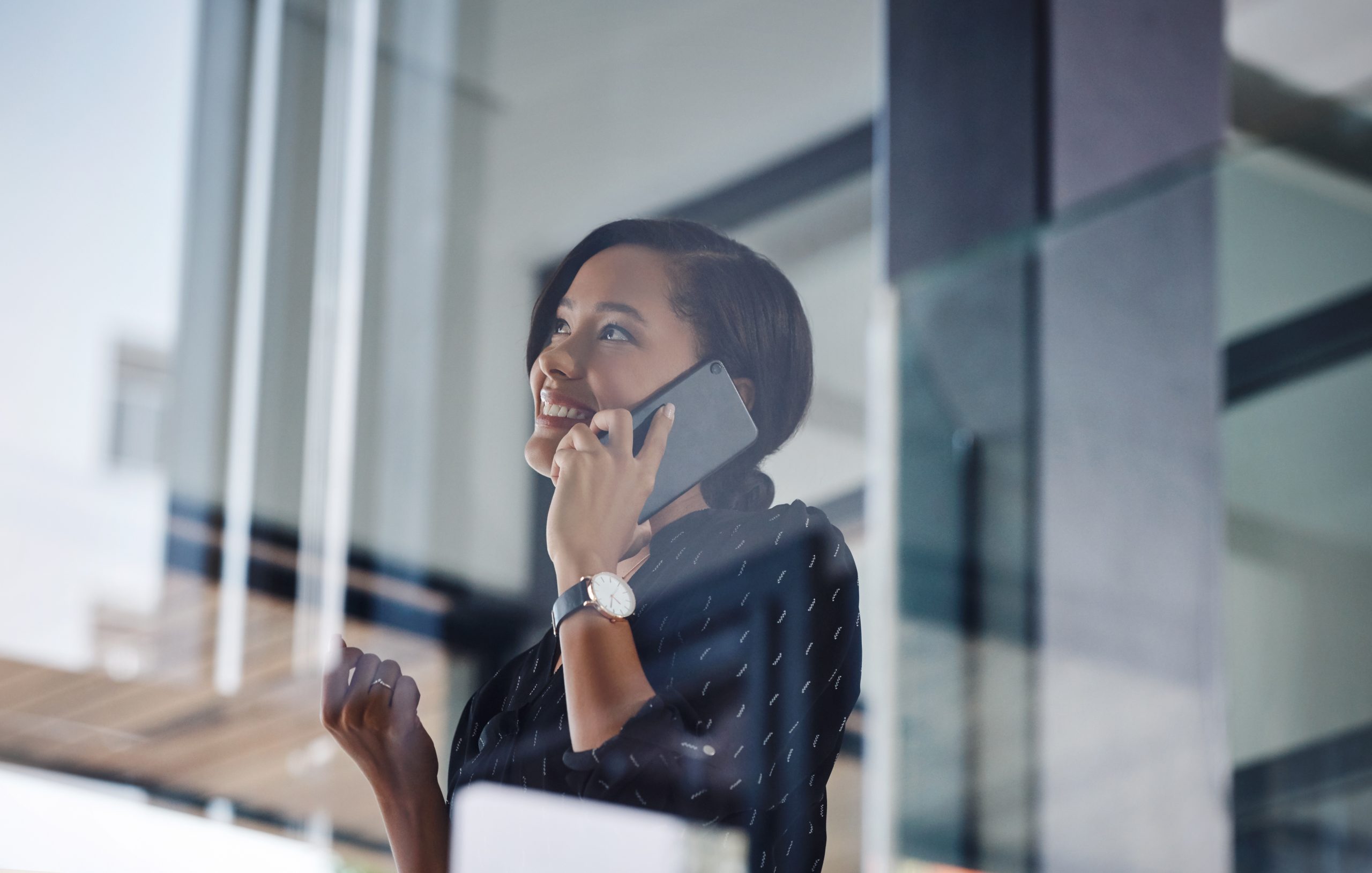 Happy, phone call and glass with business woman for communication, virtual advisor and planning. Feedback, contact and professional chat with person in agency for connection, discussion and low angle